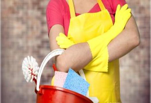 Woman with cleaning supplies