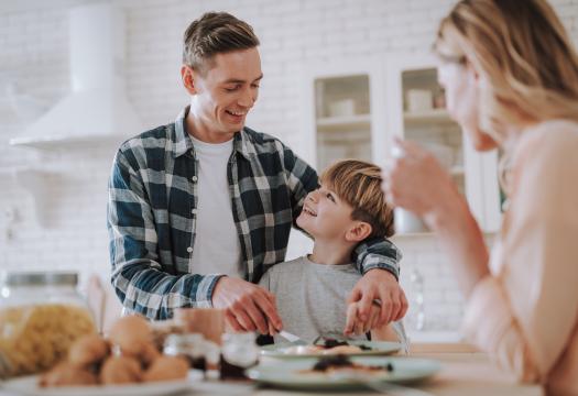 Family Eating Breakfast Together in Kitchen