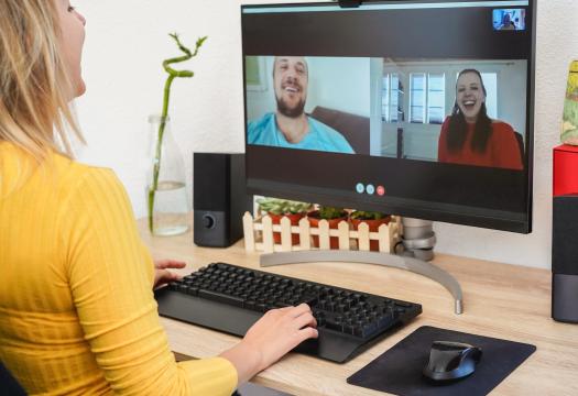 Young woman having a video call with friends during isolation quarantine.