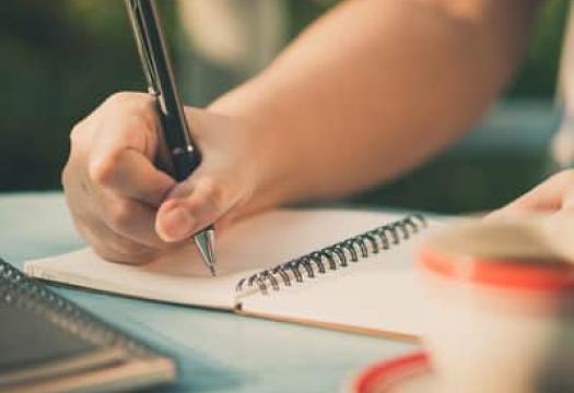 Journaling on a table with tea