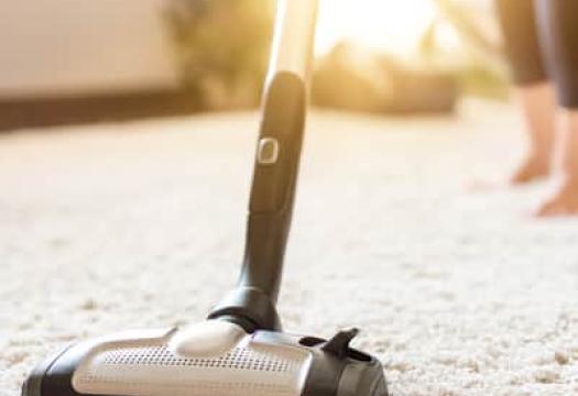 Vacuuming carpet