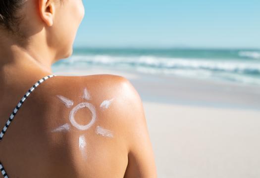 Woman with sunscreen sun drawing on her shoulder | Merry Maids