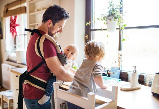 Dad and kids washing dishes in sink