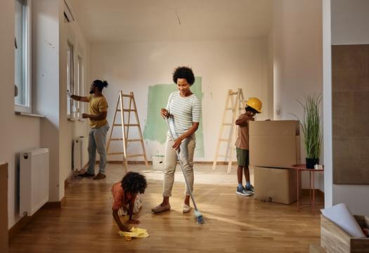 African American family cleaning their new home during renovations | Merry Maids