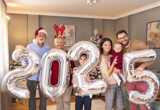 Beautiful happy multi-generation family celebrating Christmas at home. | Merry Maids
